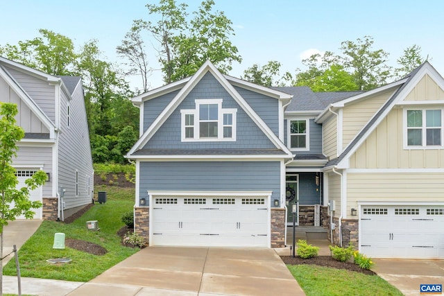 712 Empire St, Charlottesville, VA 22901 - craftsman house featuring board and batten siding, stone siding, driveway, and an attached garage