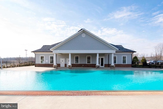 swimming pool featuring fence