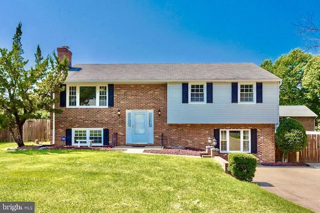12016 Branchwater St, Fredericksburg, VA 22407 - bi-level home featuring a chimney and brick siding