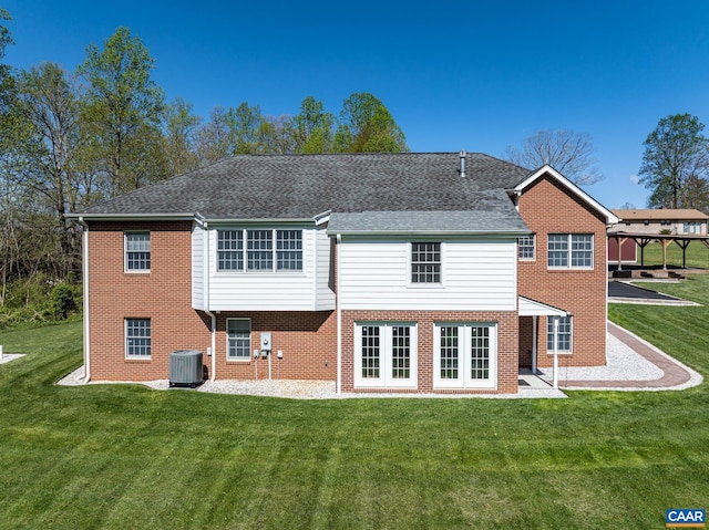 105 Squirrel Path, Stanardsville, VA 22973 - back of property with brick siding, a lawn, central AC, and a patio
