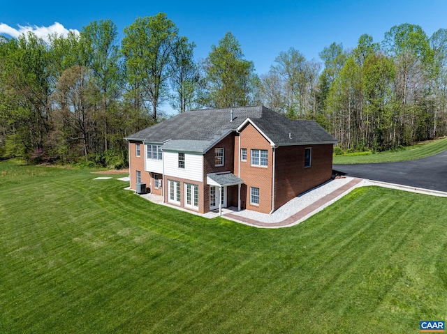105 Squirrel Path, Stanardsville, VA 22973 - view of side of property with french doors, a yard, brick siding, and central AC