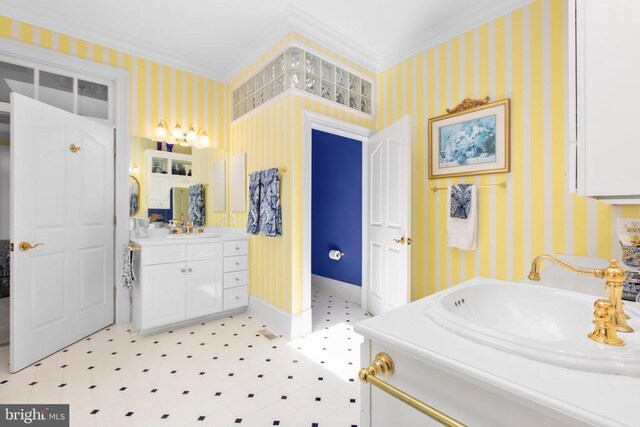 11306 Stonewall Jackson Dr, Spotsylvania, VA 22551 - bathroom featuring wallpapered walls, crown molding, tile patterned floors, vanity, and baseboards
