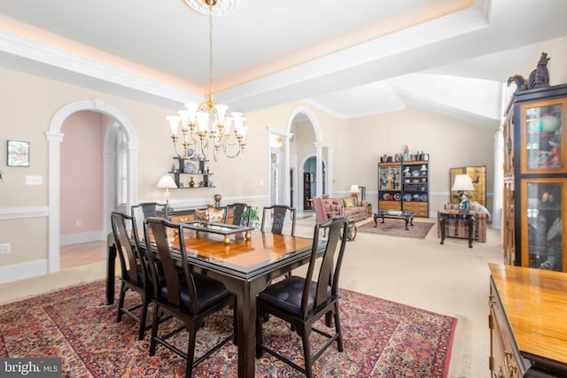 11306 Stonewall Jackson Dr, Spotsylvania, VA 22551 - dining space with arched walkways, a chandelier, a raised ceiling, and carpet flooring