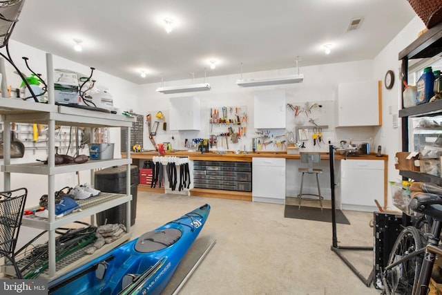 11306 Stonewall Jackson Dr, Spotsylvania, VA 22551 - misc room featuring a workshop area and concrete floors