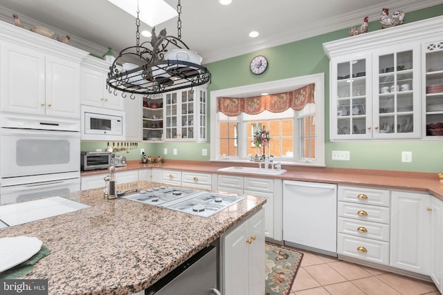 11306 Stonewall Jackson Dr, Spotsylvania, VA 22551 - kitchen featuring white appliances, a chandelier, white cabinets, glass insert cabinets, and light tile patterned floors
