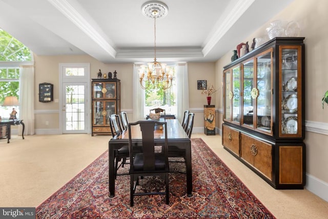 11306 Stonewall Jackson Dr, Spotsylvania, VA 22551 - dining room featuring carpet, a chandelier, a raised ceiling, and ornamental molding