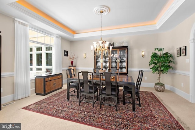 11306 Stonewall Jackson Dr, Spotsylvania, VA 22551 - dining area featuring carpet floors, a tray ceiling, a chandelier, and crown molding
