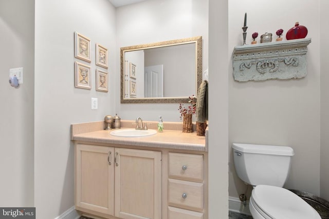 11306 Stonewall Jackson Dr, Spotsylvania, VA 22551 - bathroom with vanity, toilet, and baseboards