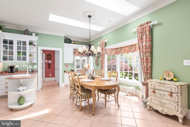 11306 Stonewall Jackson Dr, Spotsylvania, VA 22551 - dining room featuring ornamental molding, light tile patterned floors, and a chandelier