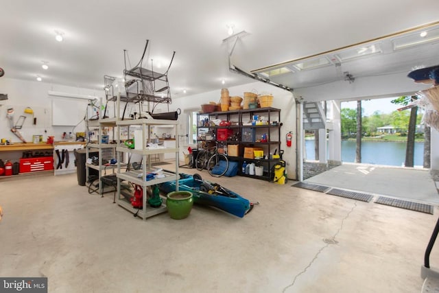 11306 Stonewall Jackson Dr, Spotsylvania, VA 22551 - garage with a water view and a workshop area