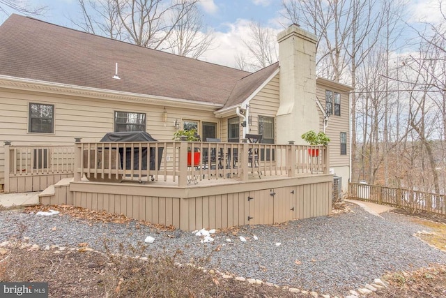 47 Marwood Dr, Palmyra, VA 22963 - back of house with a chimney, a wooden deck, and fence