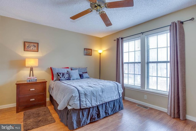 47 Marwood Dr, Palmyra, VA 22963 - bedroom with multiple windows, a textured ceiling, visible vents, and wood finished floors