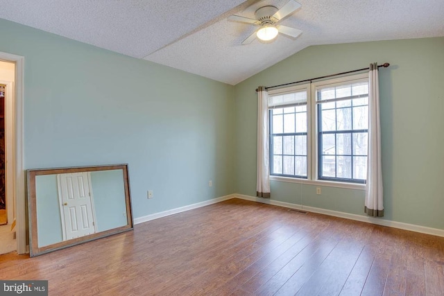 47 Marwood Dr, Palmyra, VA 22963 - empty room featuring wood finished floors, a textured ceiling, visible vents, vaulted ceiling, and ceiling fan
