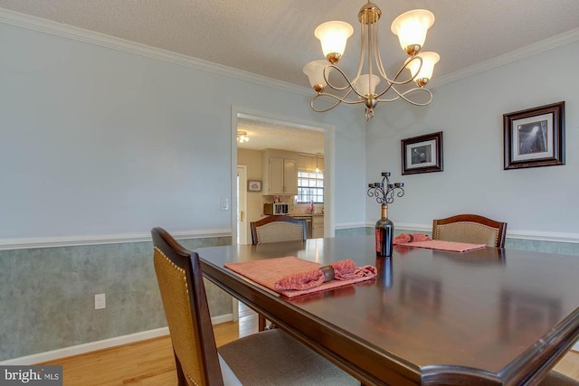 47 Marwood Dr, Palmyra, VA 22963 - dining room with ornamental molding, light wood finished floors, a chandelier, and a textured ceiling
