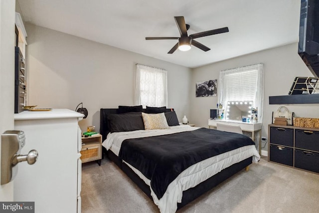  - carpeted bedroom with ceiling fan