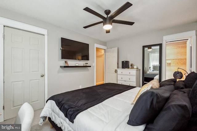  - carpeted bedroom featuring ceiling fan