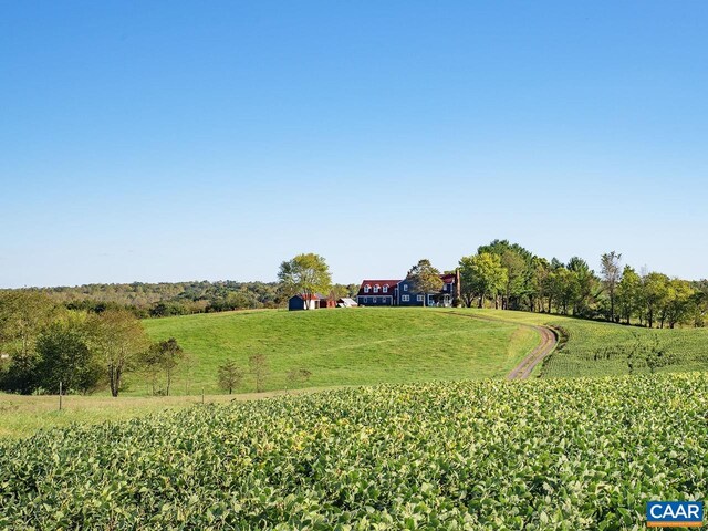 view of yard with a rural view