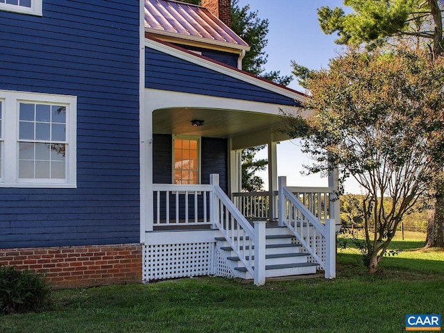 entrance to property with a yard