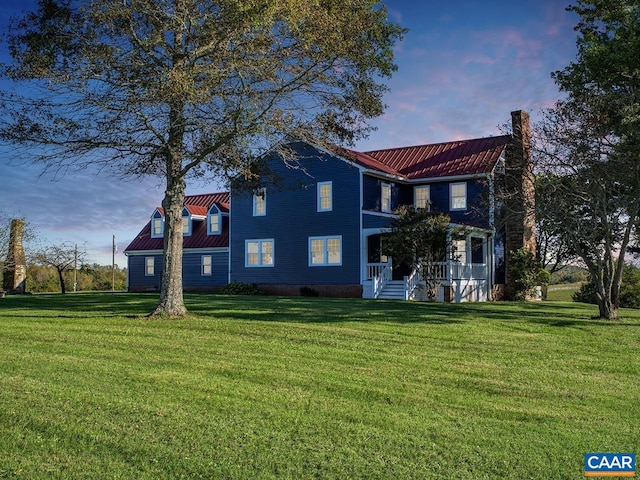 view of front of home with a yard