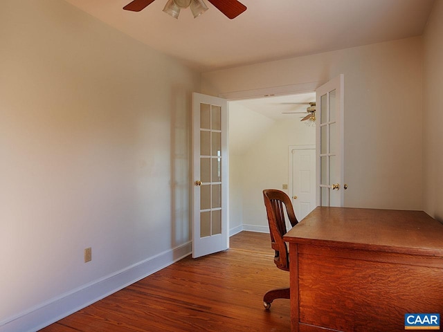 unfurnished office with wood-type flooring, ceiling fan, and french doors