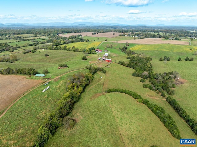 drone / aerial view featuring a mountain view and a rural view