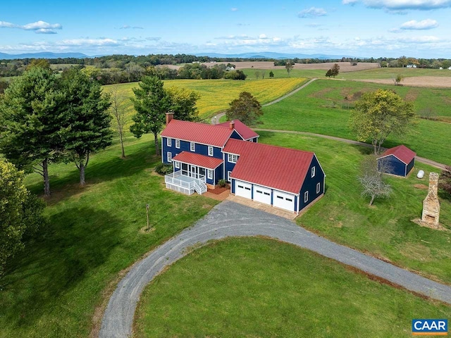 birds eye view of property with a rural view