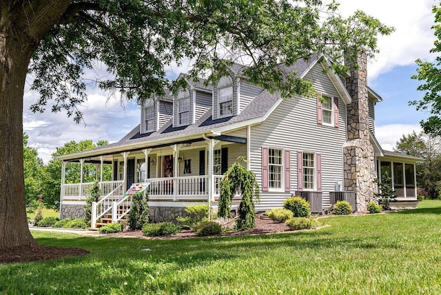 17962 Old Barn Ln, Elkton, VA 22827 - view of front of property with a porch, a front lawn, a sunroom, a chimney, and a shingled roof