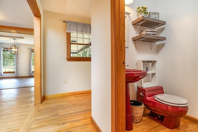 17962 Old Barn Ln, Elkton, VA 22827 - hallway featuring wood finished floors and a chandelier