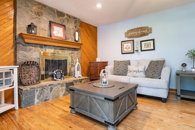 17962 Old Barn Ln, Elkton, VA 22827 - living area with light wood-style floors, a stone fireplace, recessed lighting, and wood walls