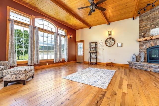 17962 Old Barn Ln, Elkton, VA 22827 - living area featuring a wood ceiling with exposed beams, ceiling fan, hardwood / wood-style floors, plenty of natural light, and a stone fireplace
