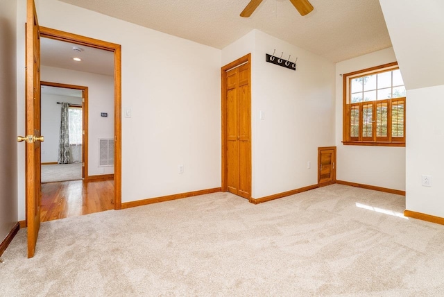 17962 Old Barn Ln, Elkton, VA 22827 - empty room with light carpet and a ceiling fan