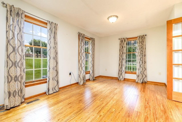 17962 Old Barn Ln, Elkton, VA 22827 - empty room with plenty of natural light and wood finished floors