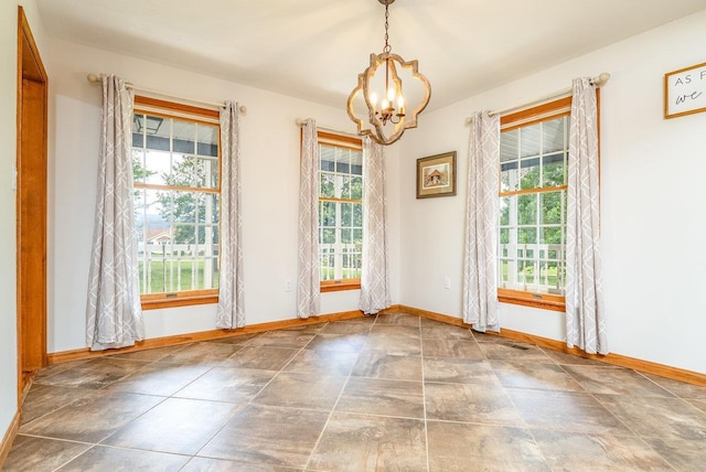17962 Old Barn Ln, Elkton, VA 22827 - unfurnished room featuring plenty of natural light, a chandelier, and stone finish floors