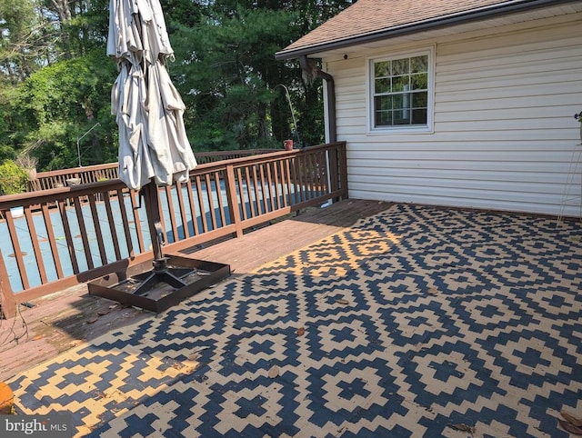  - wooden terrace featuring view of scattered trees
