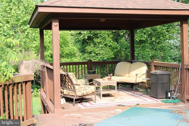  - wooden deck featuring an outdoor hangout area and a gazebo