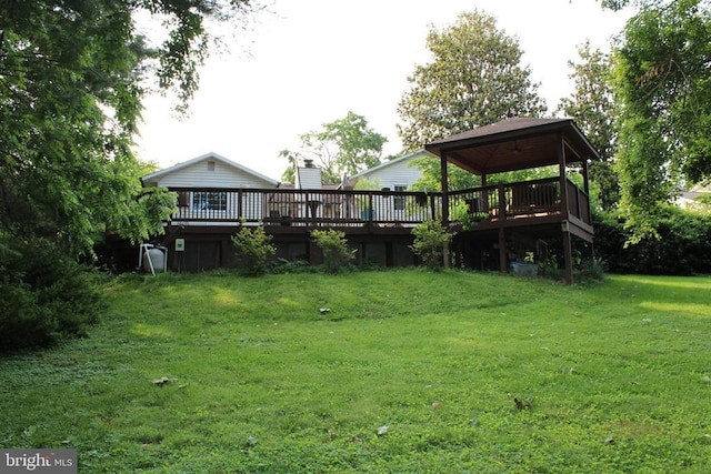  - view of green lawn featuring a deck