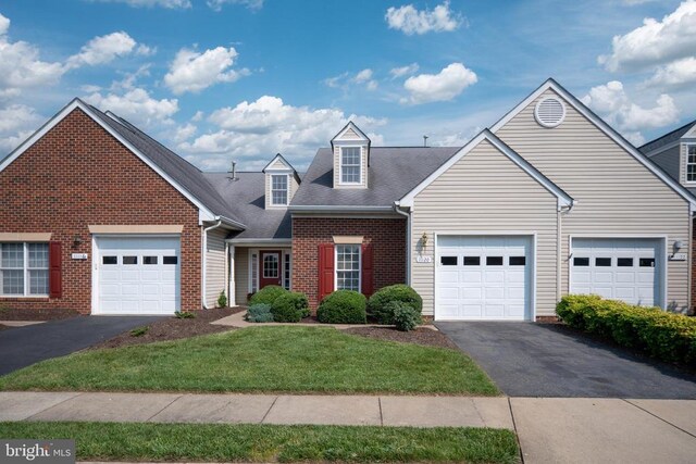 11120 Dragons Lair Dr, Fredericksburg, VA 22407 - view of front of property featuring driveway, brick siding, a front yard, and a garage