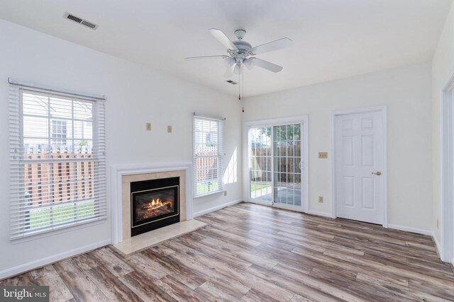 11120 Dragons Lair Dr, Fredericksburg, VA 22407 - unfurnished living room with wood finished floors, a premium fireplace, and a ceiling fan