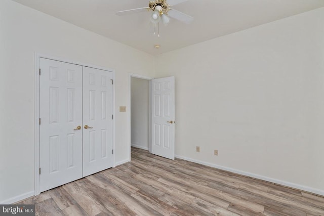 11120 Dragons Lair Dr, Fredericksburg, VA 22407 - unfurnished bedroom featuring wood finished floors, a closet, and ceiling fan