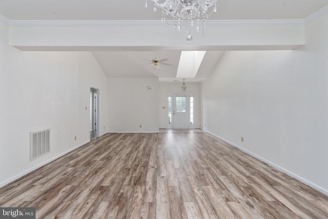 11120 Dragons Lair Dr, Fredericksburg, VA 22407 - unfurnished living room featuring wood finished floors, lofted ceiling, a chandelier, ceiling fan, and ornamental molding