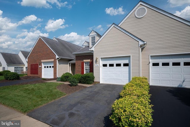 11120 Dragons Lair Dr, Fredericksburg, VA 22407 - view of front of house with asphalt driveway, brick siding, and a front yard