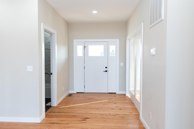 entrance foyer with light hardwood / wood-style floors