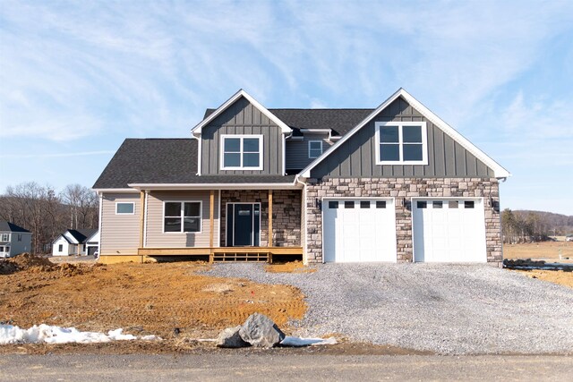 view of front of property with a garage and a porch