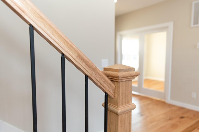 stairway featuring wood-type flooring