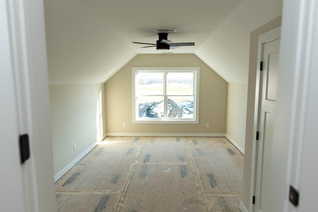 additional living space featuring lofted ceiling and ceiling fan