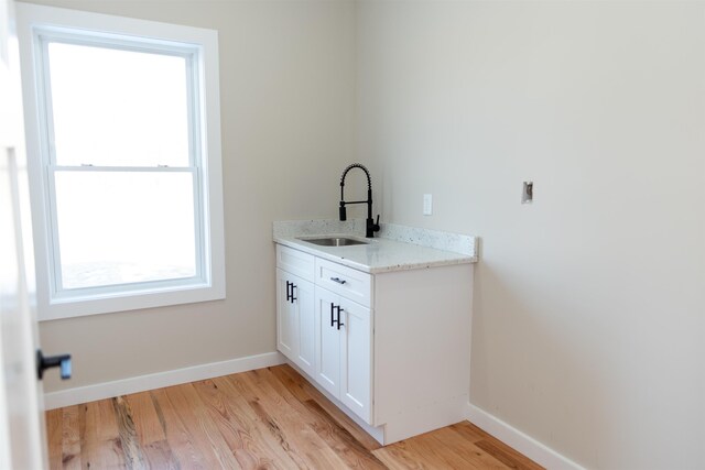 bathroom featuring sink and hardwood / wood-style floors