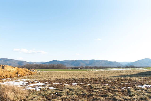 view of mountain feature with a rural view