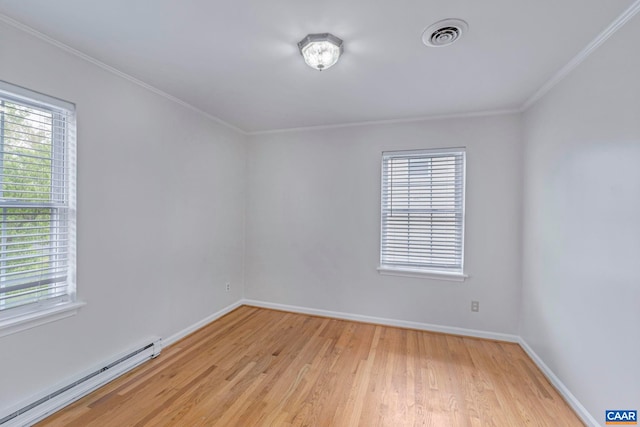 empty room featuring a baseboard radiator, light wood-style flooring, healthy amount of natural light, baseboards, and crown molding