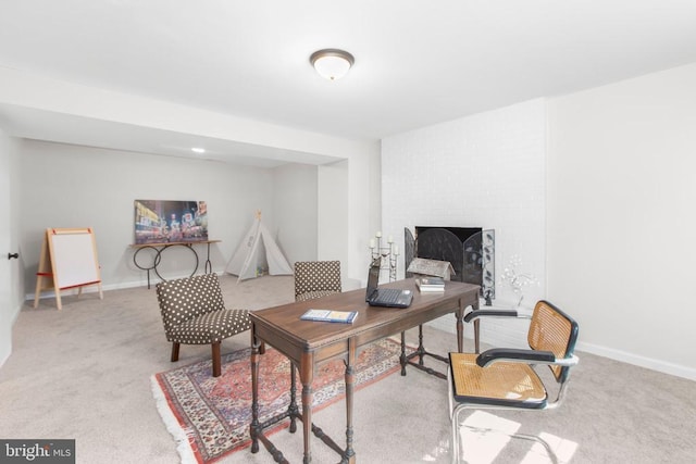 carpeted office featuring baseboards