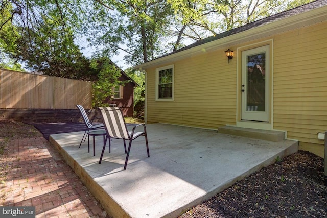 view of patio / terrace featuring fence